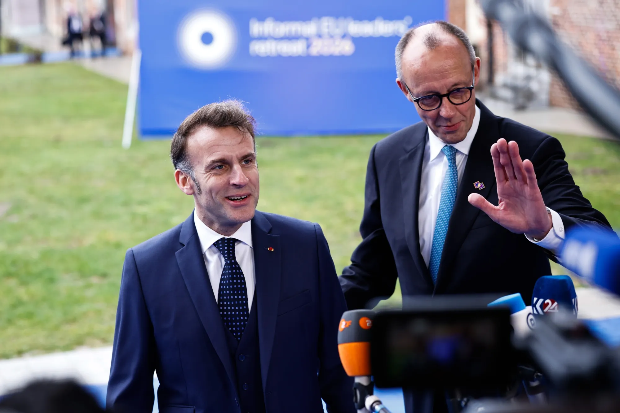 Emmanuel Macron, left, and Friedrich Merz in Rijkhoven, Belgium, on Feb. 12.