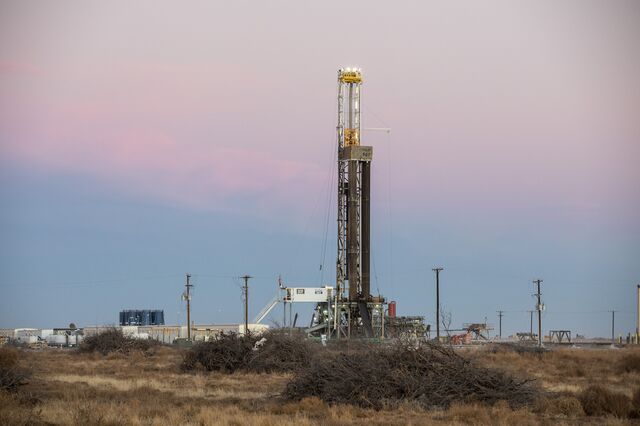 An oil drilling rig operates near Midland, Texas, U.S., on Saturday, Jan. 29, 2022. 