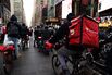Demonstrators March For Food Delivery Workers Rights