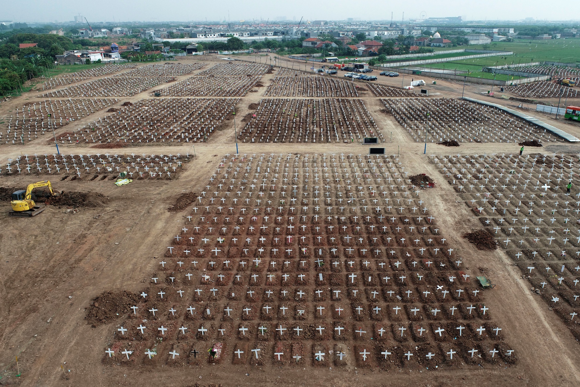 Crosses mark the graves of Covid-19 fatalities at the Rorotan cemetery in Jakarta, Indonesia.&nbsp;