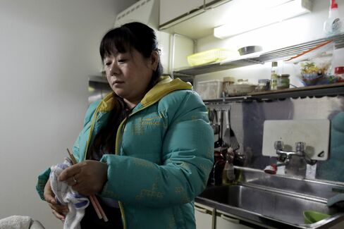Tang Xili at a shelter for Chinese trainees in Hashima
