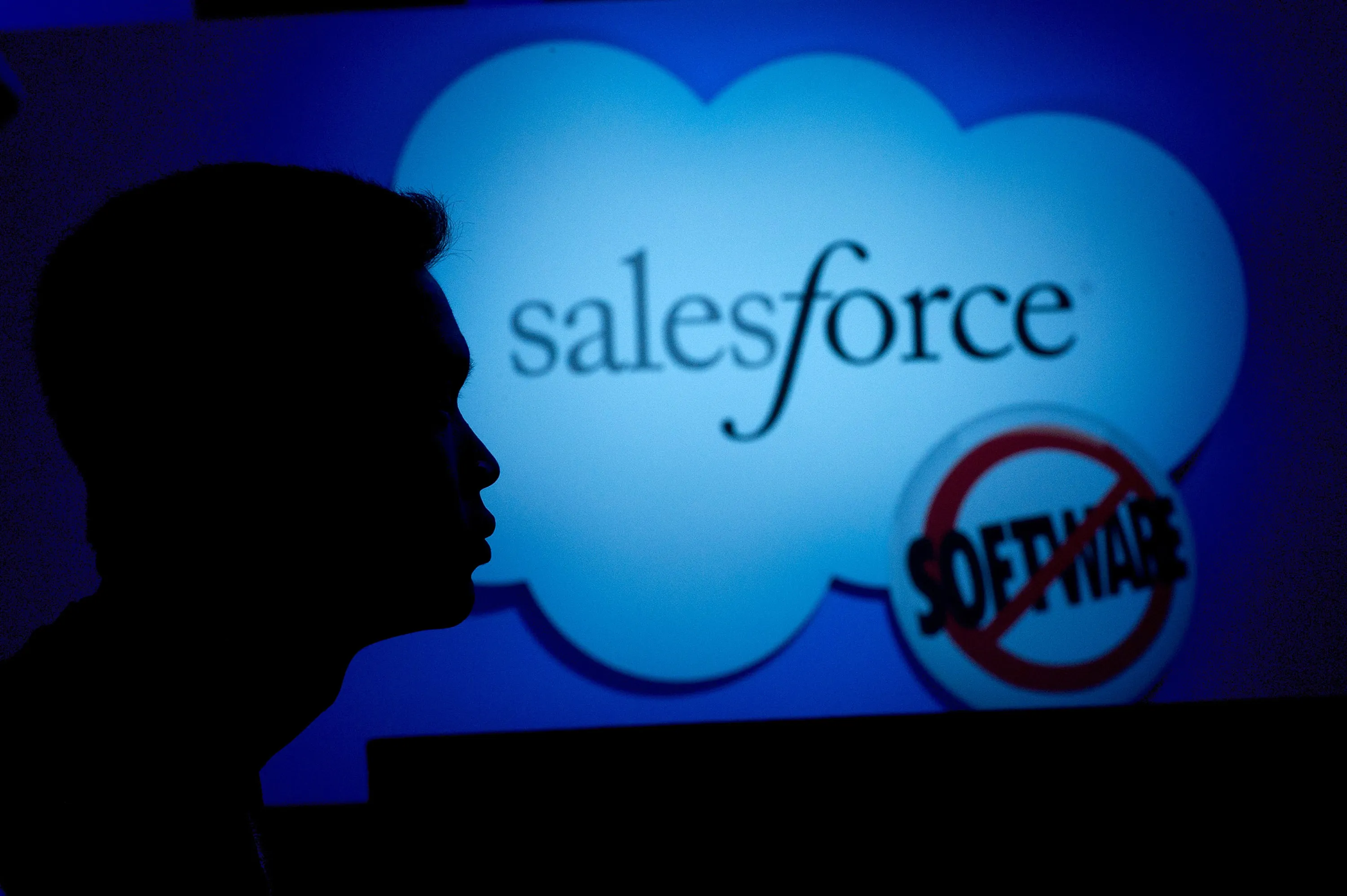 A DreamForce attendee listens to Marc Benioff, chairman and chief executive officer of SalesForce.com, as he delivers the keynote speech during DreamForce 2011 in San Francisco, California, U.S., on Wednesday, Aug 31, 2011.
