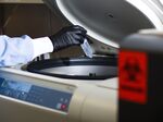 A research associate works at the Moderna Therapeutics Inc. lab in Cambridge, Massachusetts, U.S., on Tuesday, Nov. 14, 2017.
