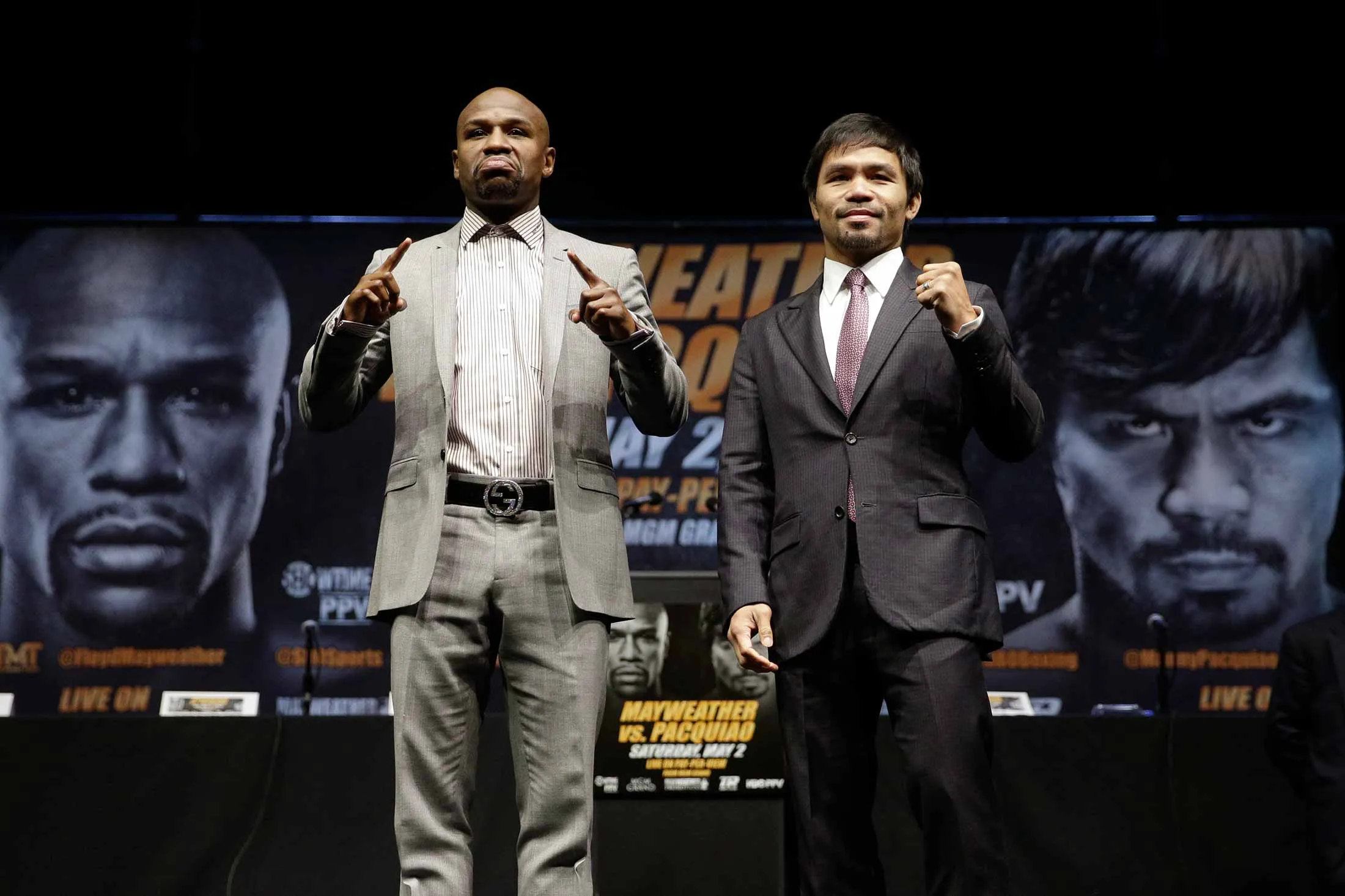 Boxers Floyd Mayweather Jr., left, and Manny Pacquiao, of the Philippines, pose for photos after a news conference in Los Angeles, on March 11.
