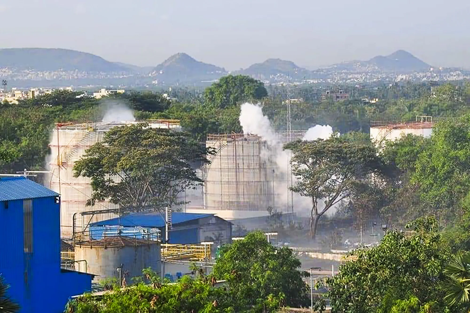Smokes rise from an LG Polymers plant following a gas leak incident in Visakhapatnam on May 7.