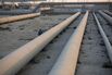 Transport pipes leading to oil storage tanks at a Saudi Aramco oil refinery.