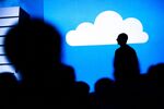 The silhouette of Scott Guthrie, executive vice president of the cloud and enterprise group at Microsoft Corp., is seen as he speaks during a keynote session at the Microsoft Developers Build Conference in San Francisco, California, U.S., on Thursday, March 31, 2016.