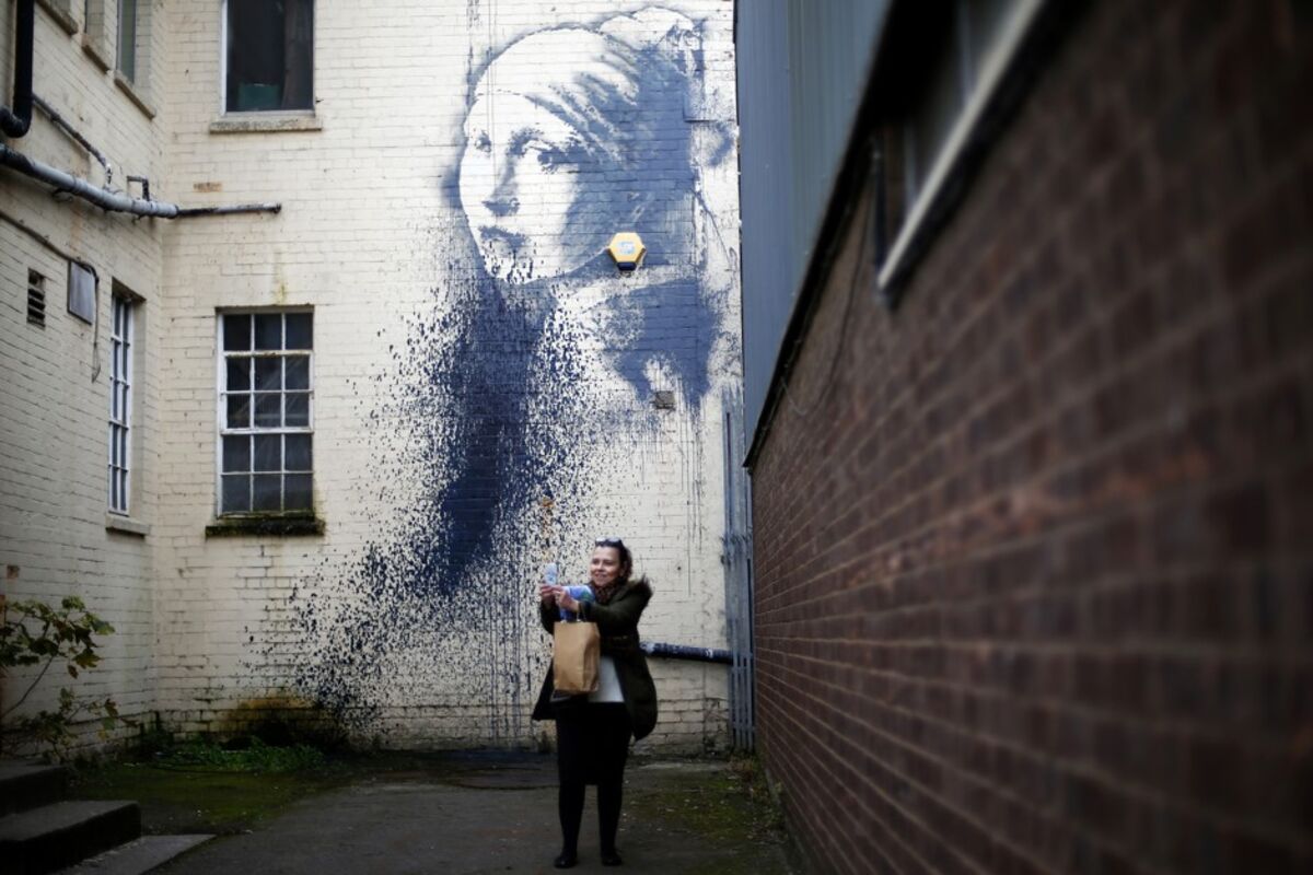 Banksy art ripped out of building wall by UK landlord