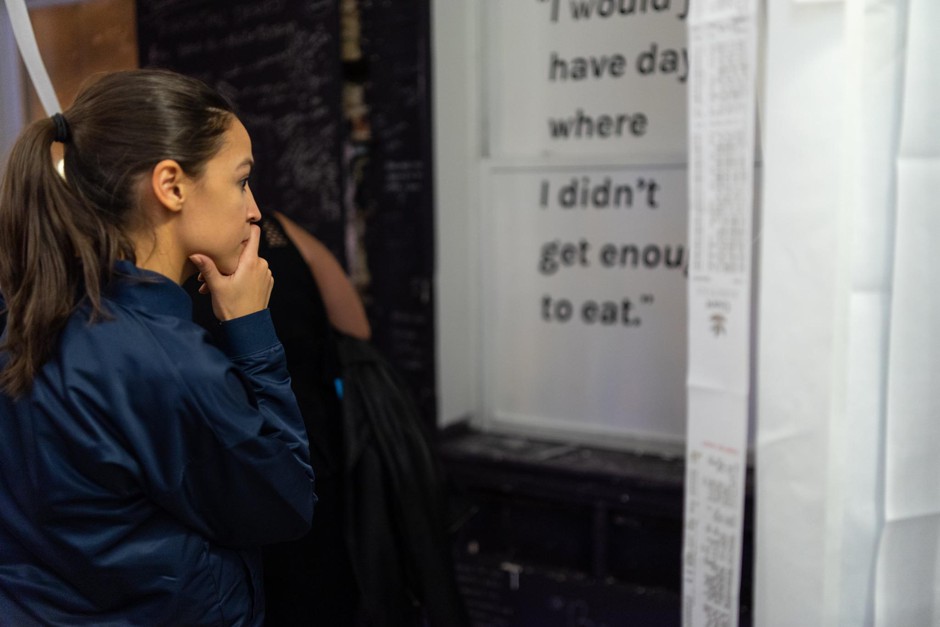 Representative Alexandria Ocasio-Cortez takes in &quot;Transaction Denied,&quot; an art installation about food insecurity.