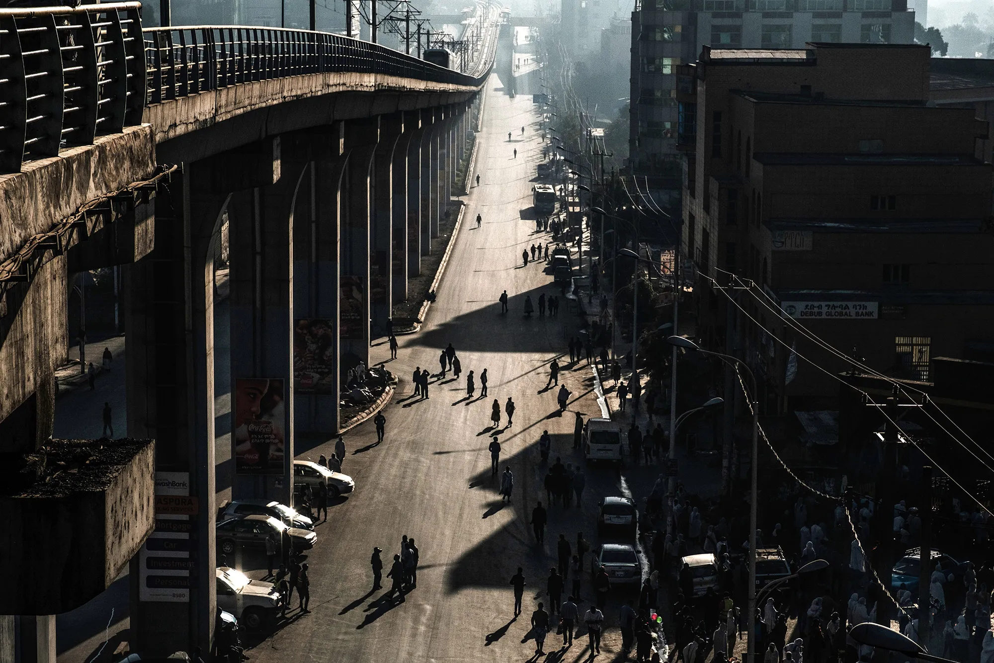 People walk on a street in Addis Ababaon February 3, 2019 during the third Car Free Day promoted by local NGOs and the Ethiopian Government.