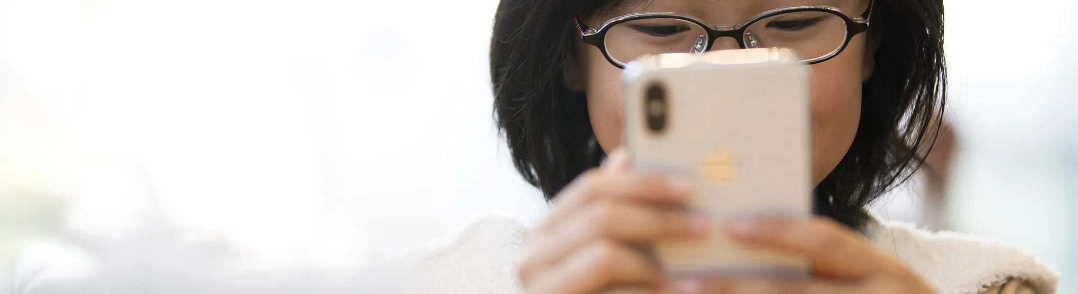 TOKYO, JAPAN - NOVEMBER 03:  A girl tries an iPhone X at the Apple Omotesando store on November 3, 2017 in Tokyo, Japan. Apple launched the latest iPhone featuring face recognition technology, a large 5.8-inch edge-to-edge high resolution OLED display and better front and back cameras with optical image stabilisation today. (Photo by Tomohiro Ohsumi/Getty Images)