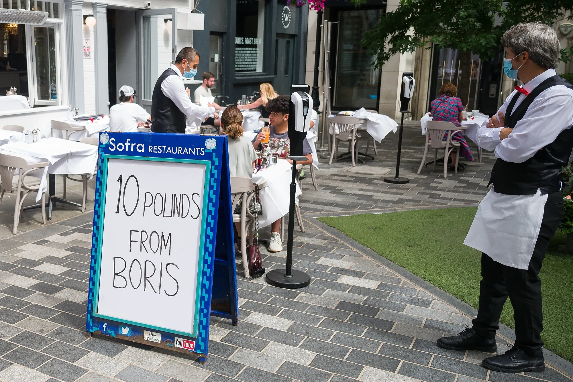 A sign advertises the "Eat Out to Help Out" discount at a restaurant in London, in 2020.