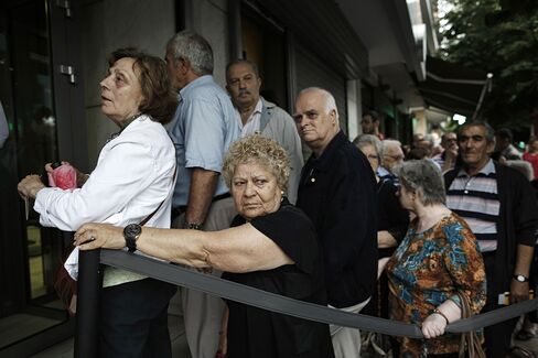 Pensioners queue at a bank branch in Thessaloniki today