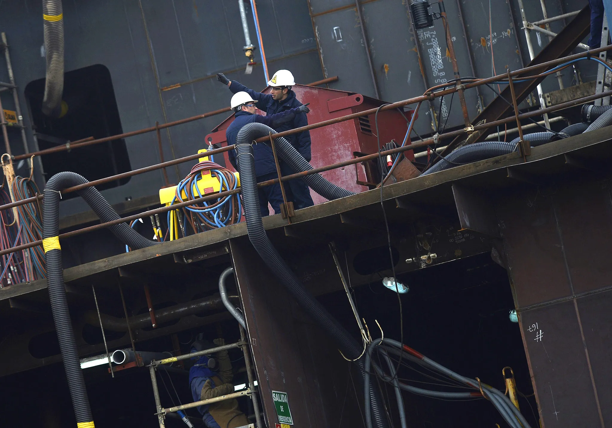 Workers at a shipyard in Vigo, northwestern Spain, on January 21, 2015
