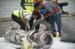 Investigators examine engine parts from Lion Air flight JT 610 on Nov. 7