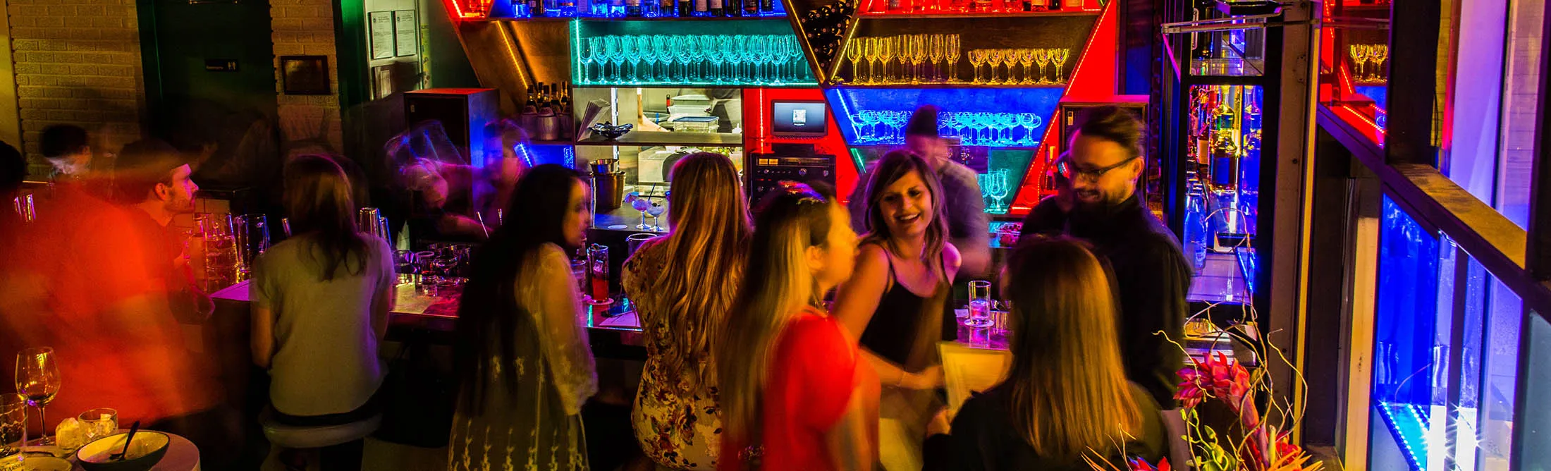 The bar’s&nbsp;interior is a neon nod to artist&nbsp;Dan Flavin’s installation in the Menil Collection.
