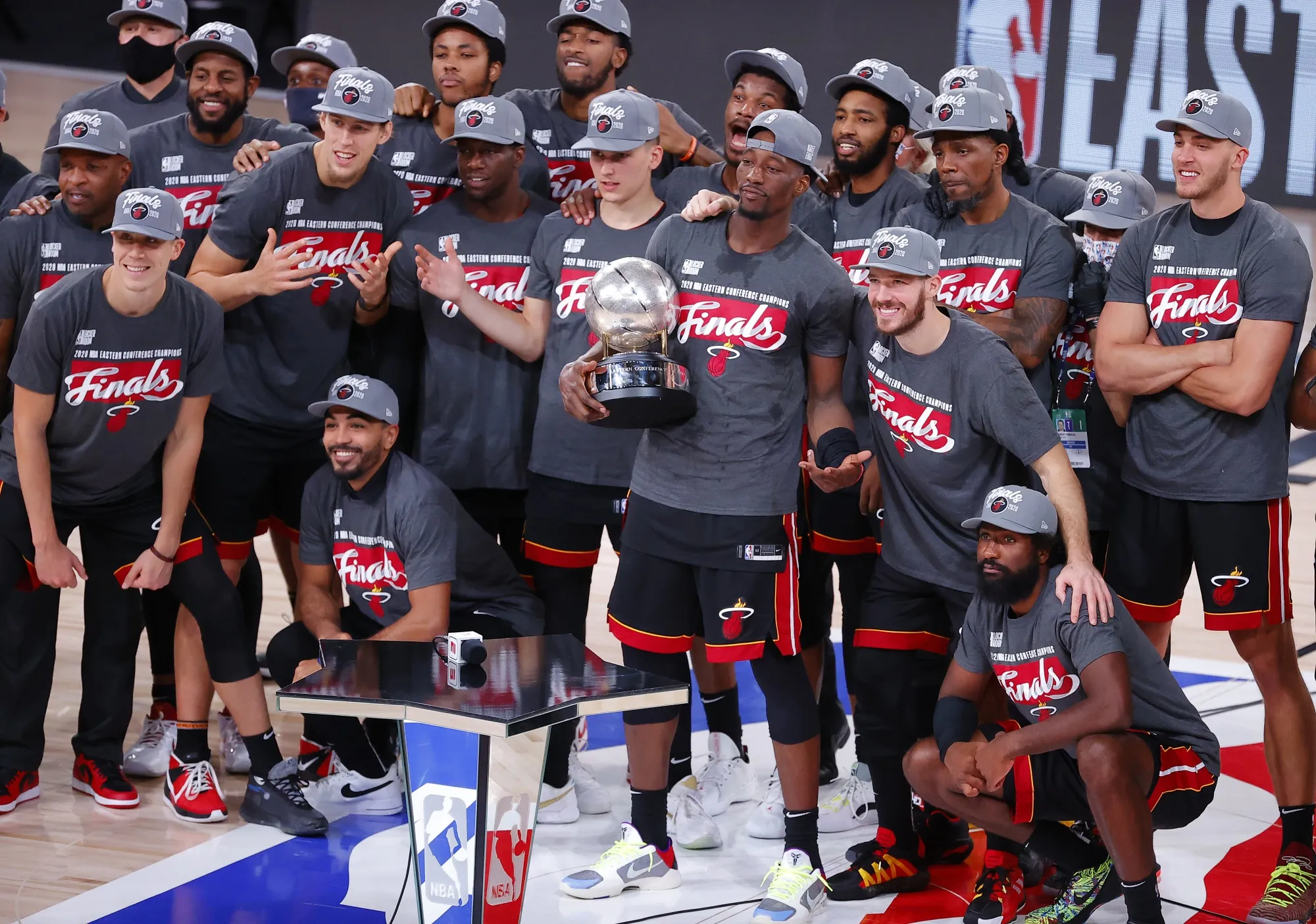 The Miami Heat celebrate with the trophy after they defeat the Boston Celtics in the&nbsp;Eastern Conference Finals on Sept. 27.