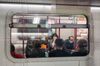 People sit in a train of MTR in Hong Kong, China, on Wednesday, Jan. 29, 2020.