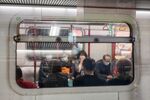 People sit in a train of MTR in Hong Kong, China, on Wednesday, Jan. 29, 2020.