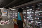 A customer shops for meat at a grocery store in Rio de Janeiro on Dec. 17, 2021.&nbsp;