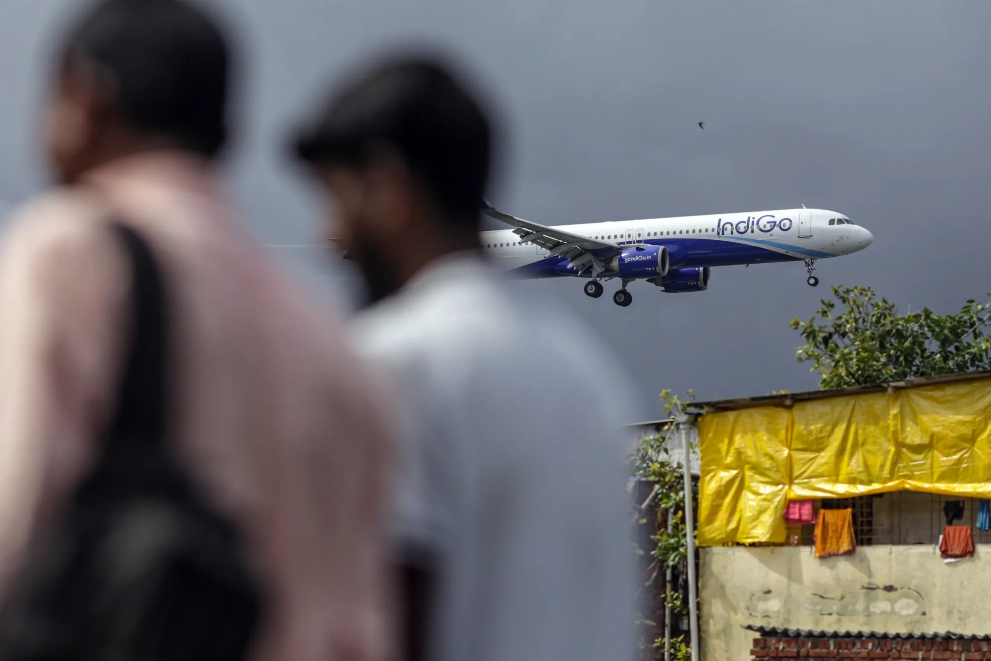 An IndiGo passenger jet prepares to land at Chhatrapati Shivaji Maharaj International Airport in Mumbai.