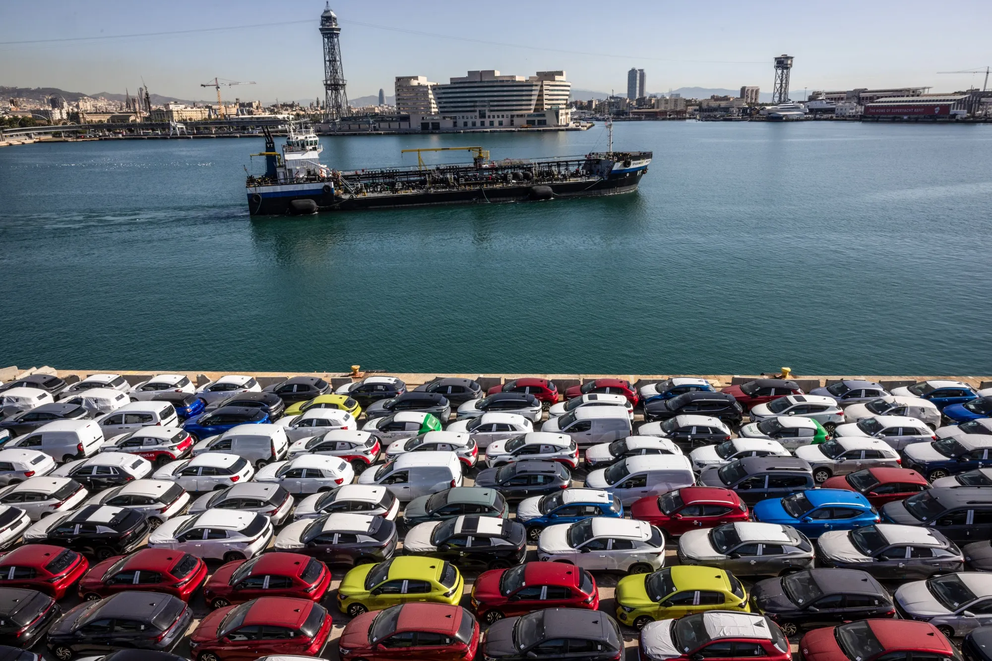 Newly manufactured automobiles on the dockside at the Port of Barcelona in Spain.