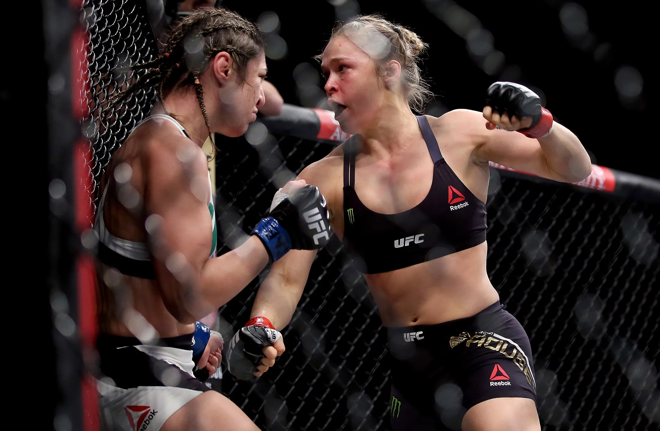 Ronda Rousey, right, fights Bethe Correia, left, in their UFC bantamweight title fight in Rio de Janeiro, on Aug. 1, 2015.
