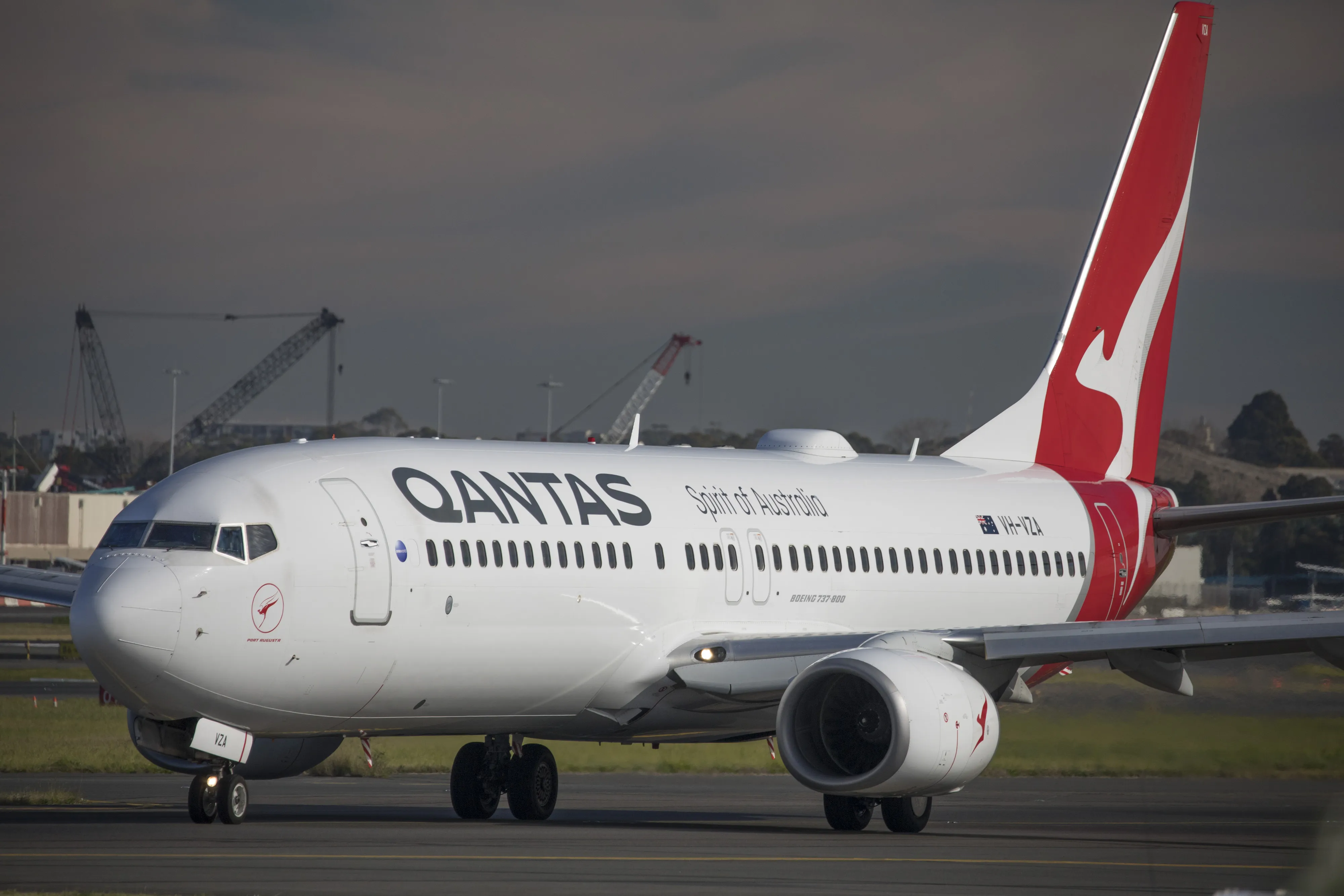 An aircraft operated by Qantas Airways Ltd. taxis on a runway at Sydney Airport in Sydney.