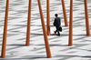 A pedestrian walks along a street in Tokyo, Japan, on Monday, June 5, 2017. Japan's revised first-quarter gross domestic product (GDP) figures will be released on June 8th.
