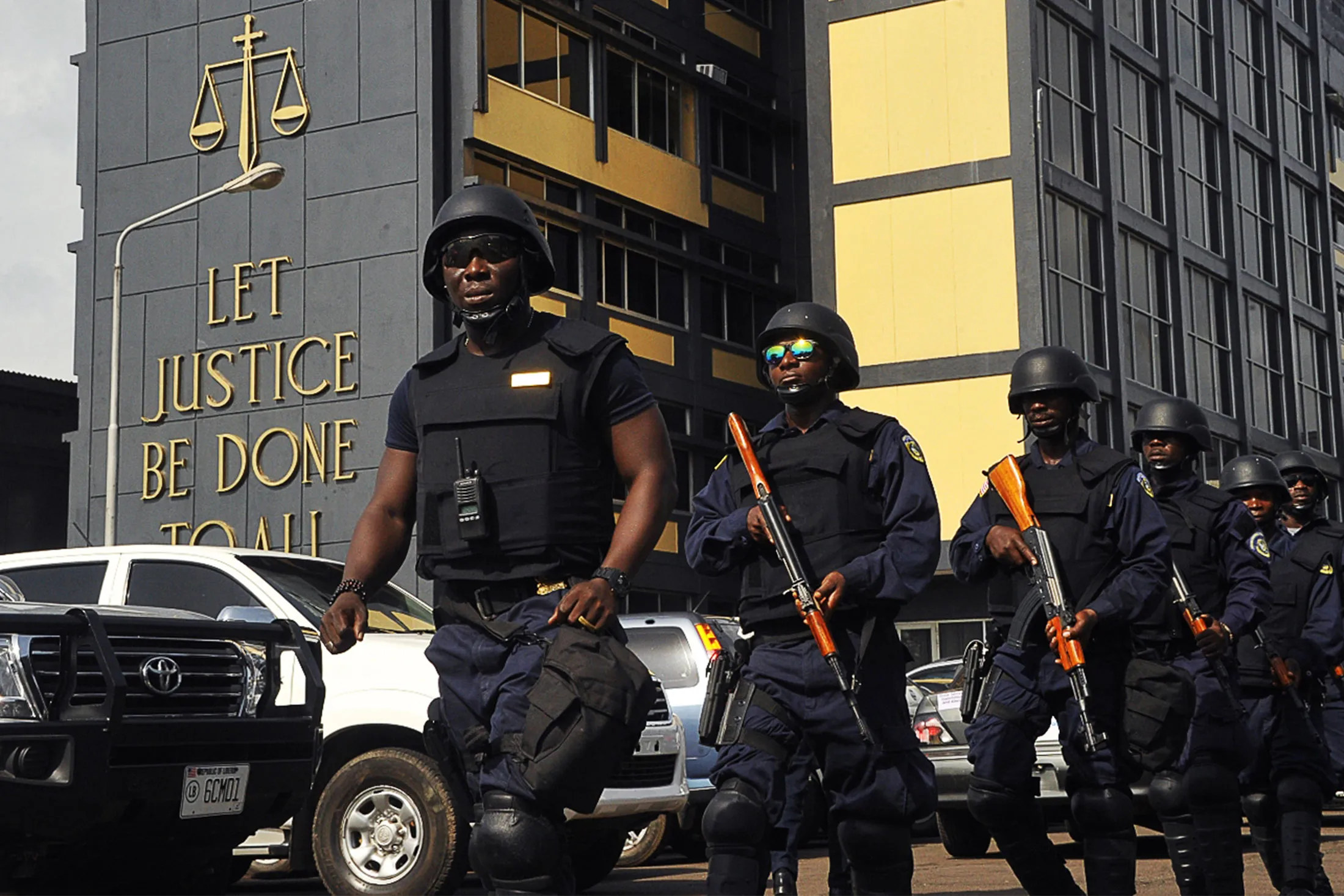 Police patrol at the Supreme Court in Monrovia on Nov. 3.