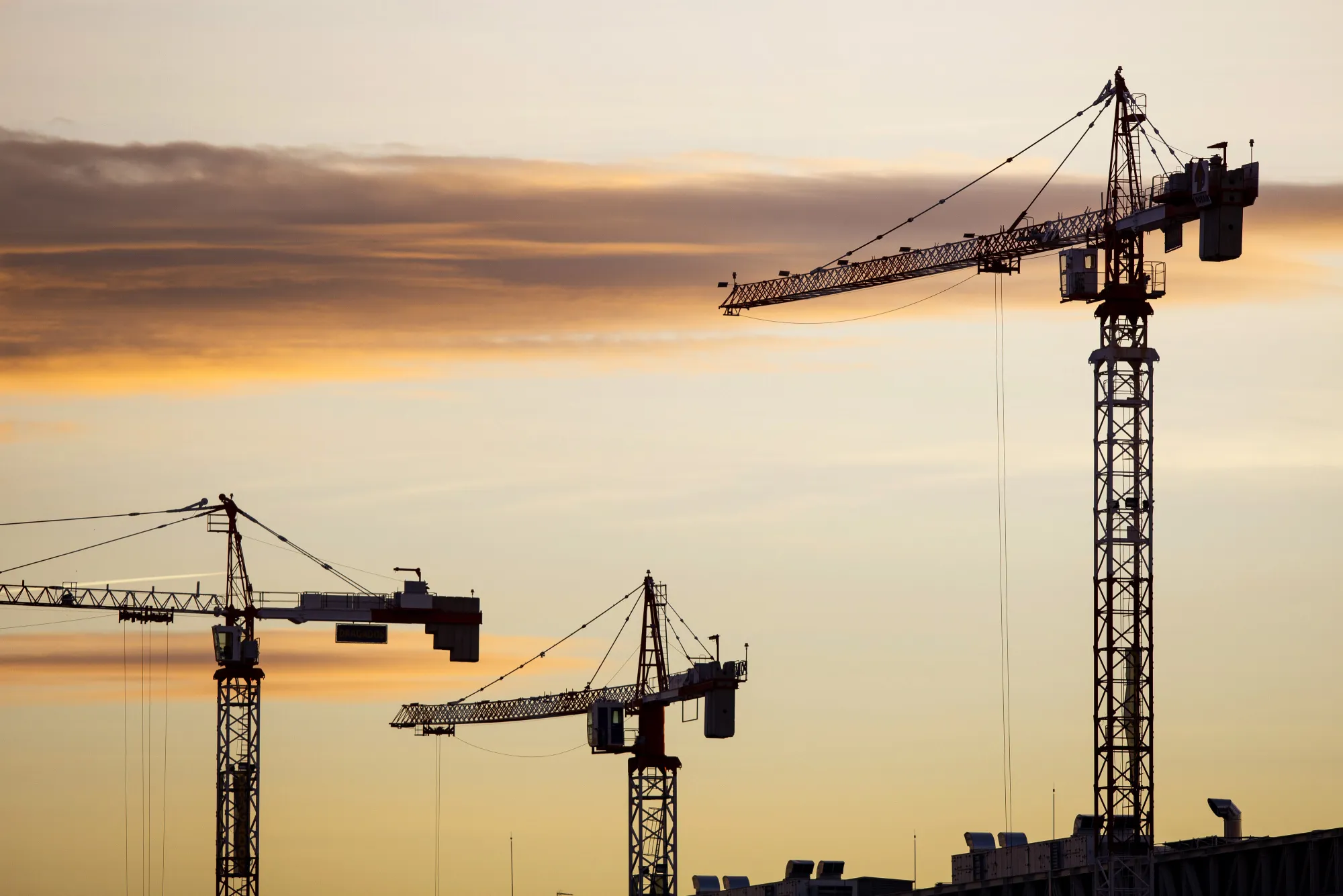Cranes stand at a construction site in Madrid, Spain, on Tuesday, Dec. 27, 2016. Spanish banks and borrowers are assessing the impact of a ruling by Europe’s top court that lenders charged too much for mortgages.