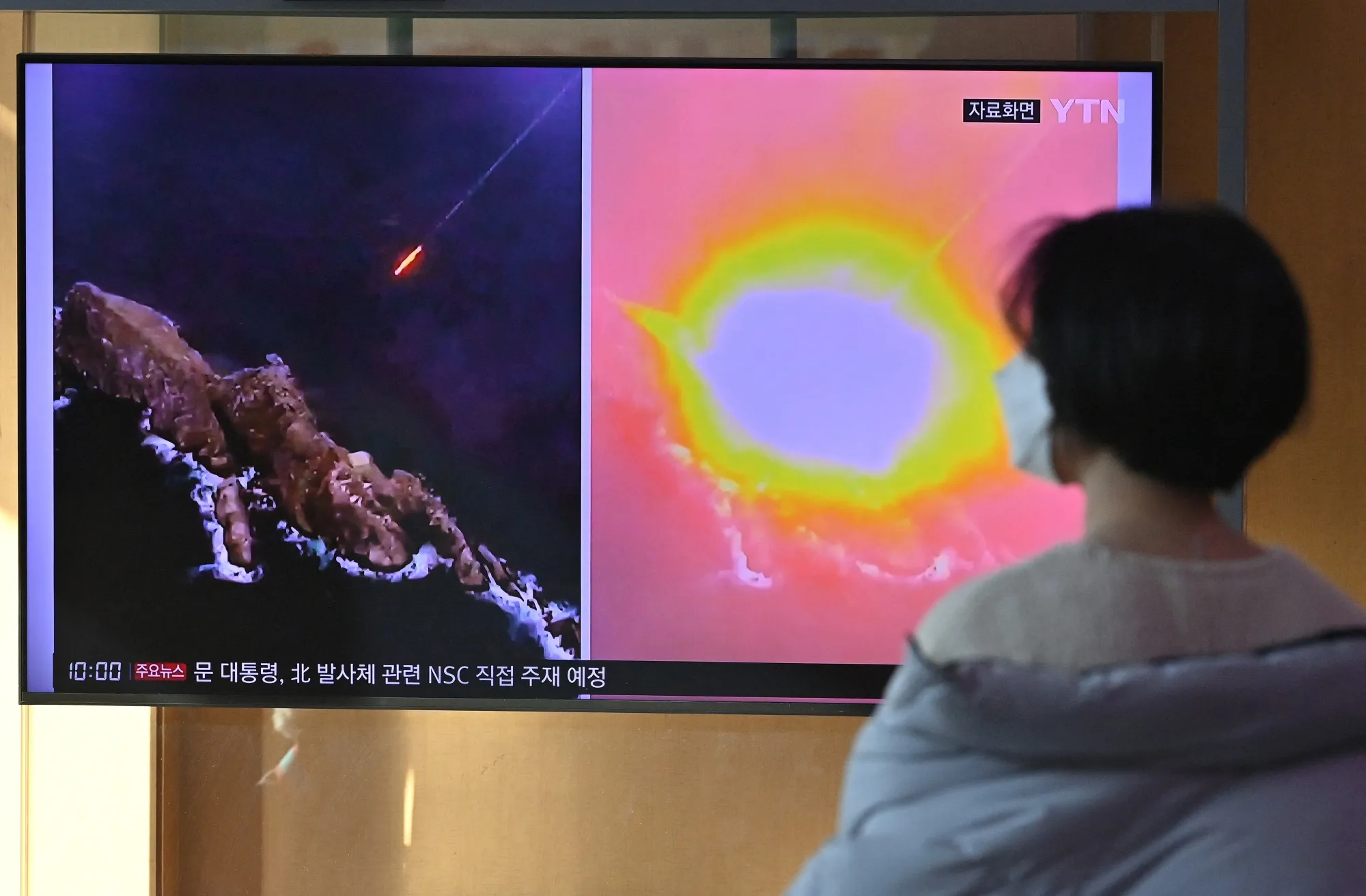 A television screen showing a news broadcast at a railway station in Seoul on Jan. 30, with file footage of a North Korean missile test. 