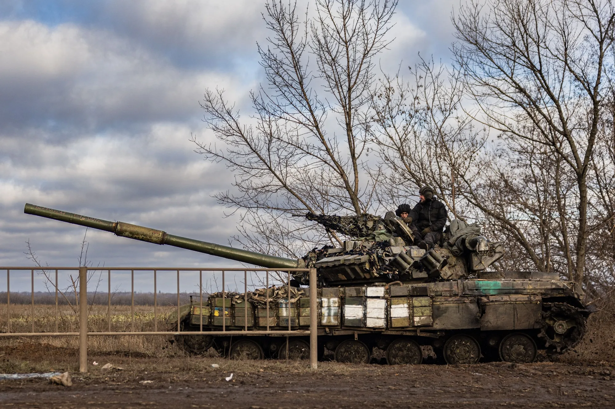 Ukrainian servicemen sit on a tank near Bakhmut, Ukraine on December 22.&nbsp;