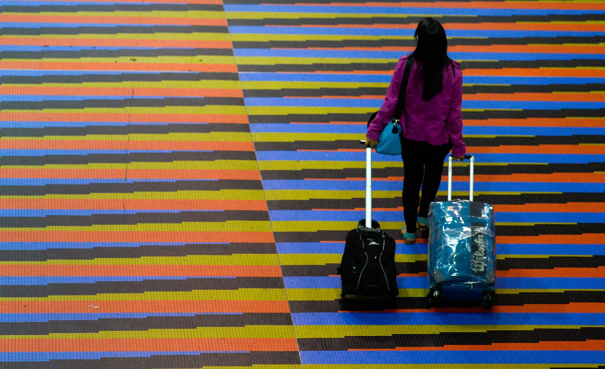 A passenger walks at Simon Bolivar international airport in Caracas.
