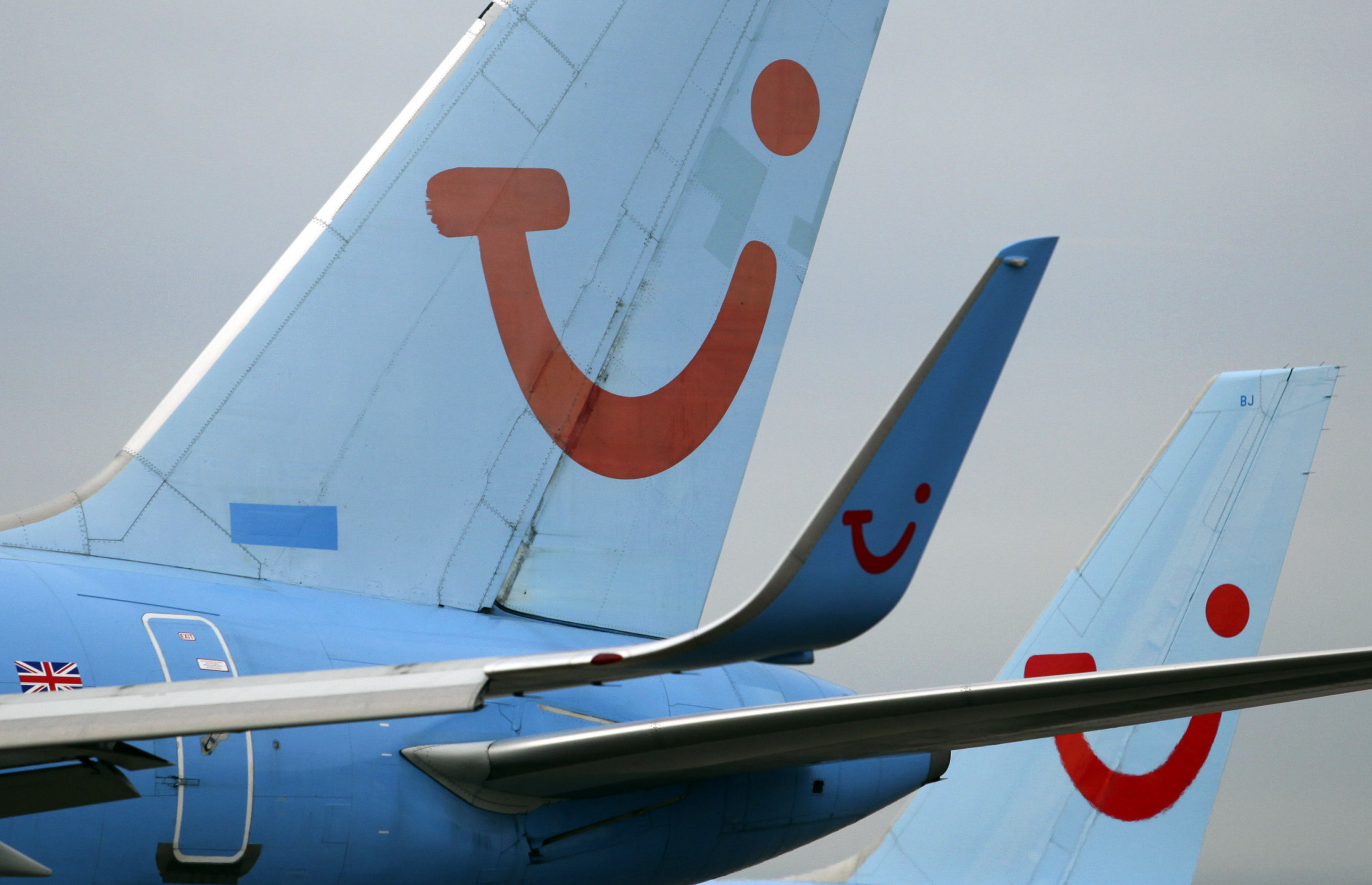 Tui company branding is seen on the taifins of&nbsp;aircraft at Manchester airport.