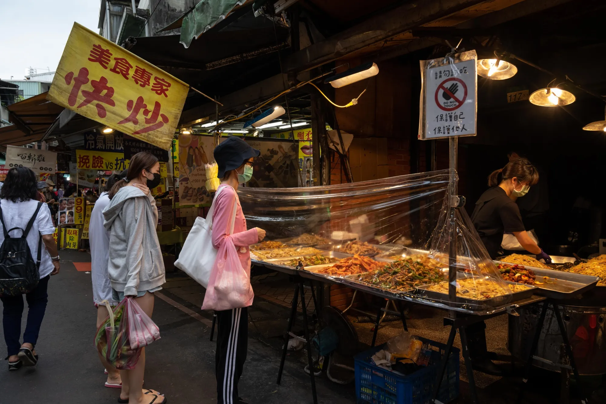 Customers buy food at market in Taipei, Taiwan.