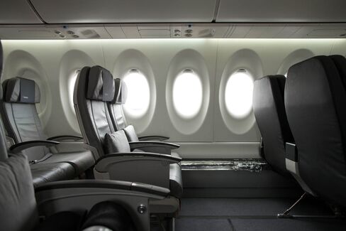 Passenger seating and windows sit inside the new Bombardier CS100 C Series aircraft.
