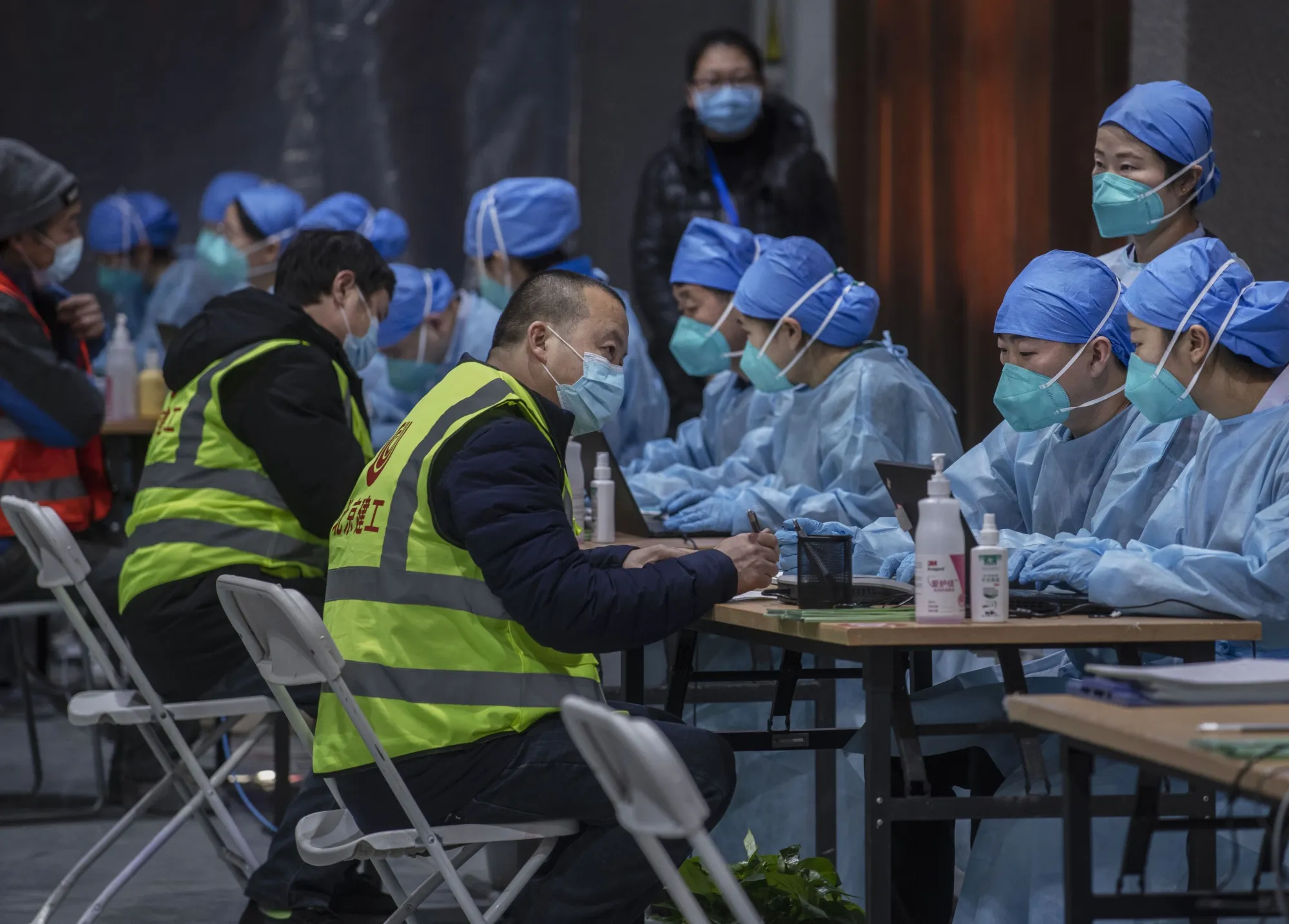 Workers register people for the Covid-19 vaccine inoculation in&nbsp;Beijing on Jan. 15.