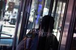 A person enters JPMorgan Chase &amp; Co. headquarters in New York, on&nbsp;Sept. 21.&nbsp;