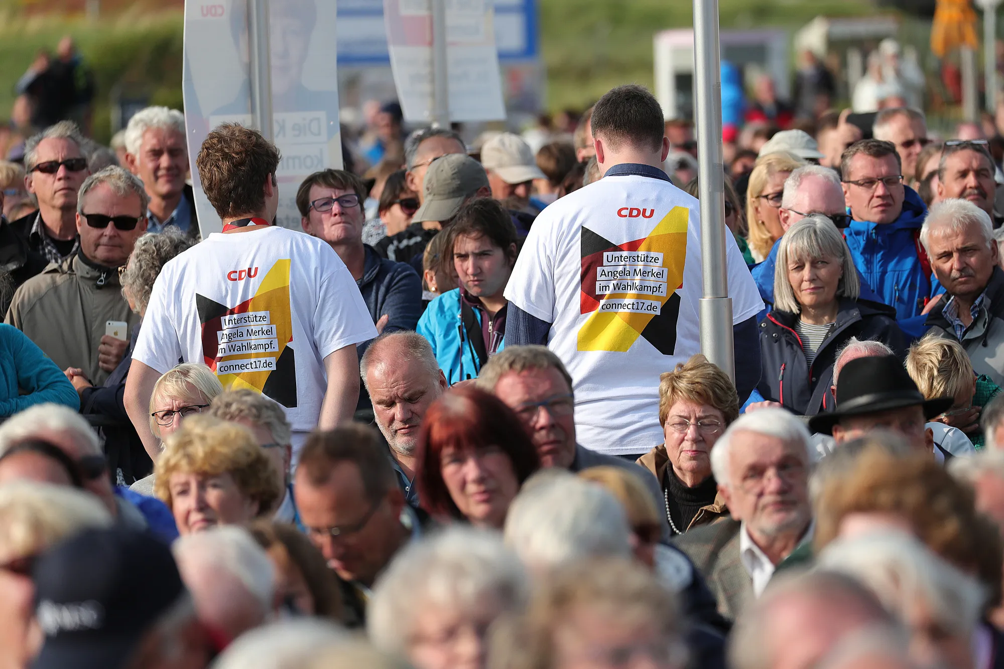 Supporters look on during a Christian Democratic Union (CDU) election campaign stop in Saint Peter-Ording, Germany.