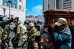 Bolivian riot police breaks up a massive funeral procession that turned into an anti-government demonstration in La Paz on Nov. 21, 2019.&nbsp;