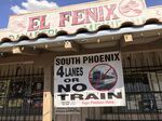 A local business displays a protest sign of the proposed extension of the light rail system along Central Avenue, in Phoenix.