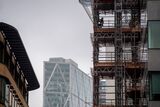 A construction worker on scaffolding in London on Oct. 12.