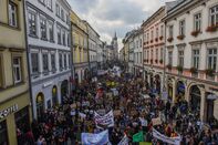 Students, parents and activists march while holding banners
