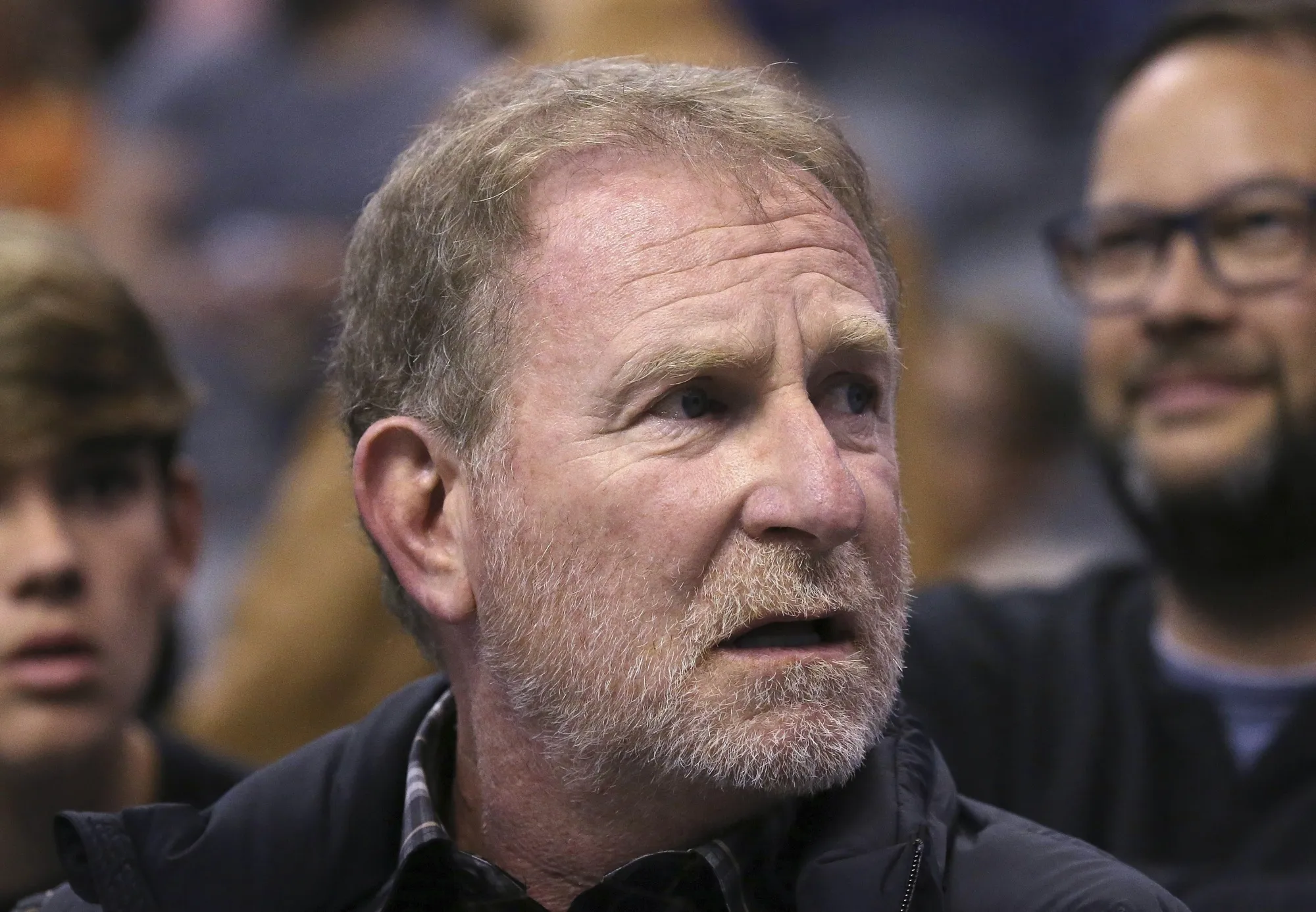 Phoenix Suns owner Robert Sarver watches the team play against the Memphis Grizzlies during the second half of an NBA basketball game in Phoenix, Dec. 11, 2019. The NBA has suspended Phoenix Suns and Phoenix Mercury owner Robert Sarver for one year, plus fined him $10 million, after an investigation found that he had engaged in what the league called “workplace misconduct and organizational deficiencies." The findings of the league's report, published Tuesday, Sept. 13, 2022, came nearly a year after the NBA asked a law firm to investigate allegations that Sarver had a history of racist, misogynistic and hostile incidents over his nearly two-decade tenure overseeing the franchise. (AP Photo/Ross D. Franklin, File)