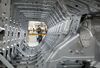 A worker operates the assembly line at the Changan Ford Mazda Plant in Nanjing, China.