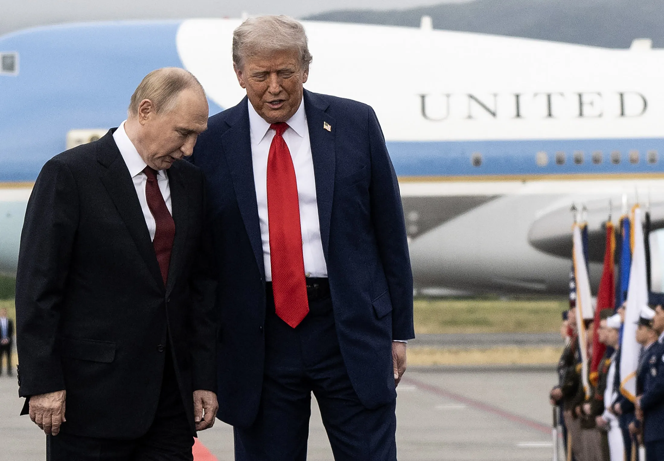 US President Donald Trump, right, and Russian President Vladimir Putin on the tarmac after they arrived at Joint Base Elmendorf-Richardson in Anchorage, Alaska, on Aug. 15.