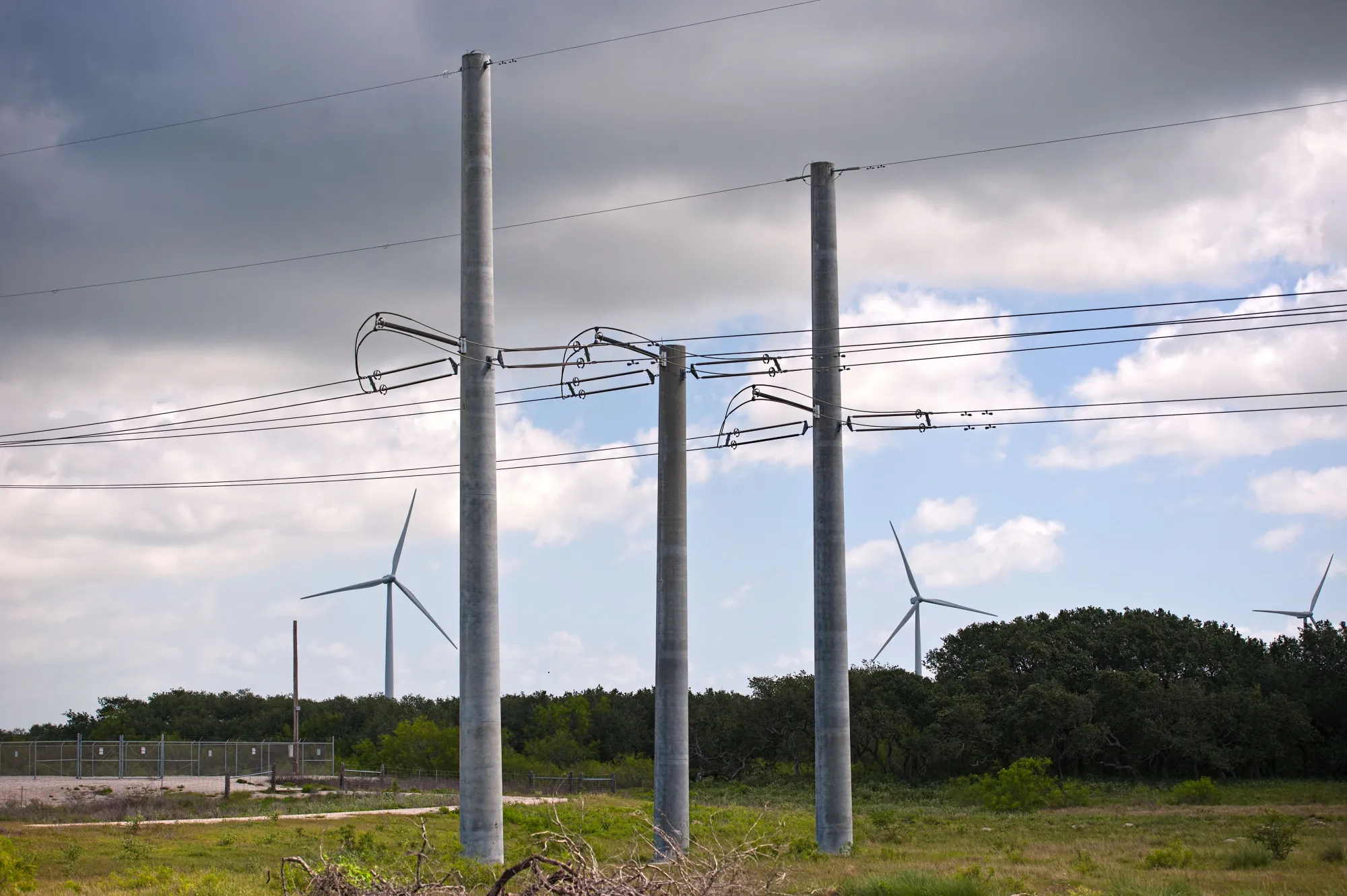 Power transmission lines stand near a wind power project in Texas, U.S.