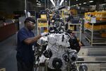 An employee assembles an engine on the production line at a manufacturing facility in Montgomery, Alabama.