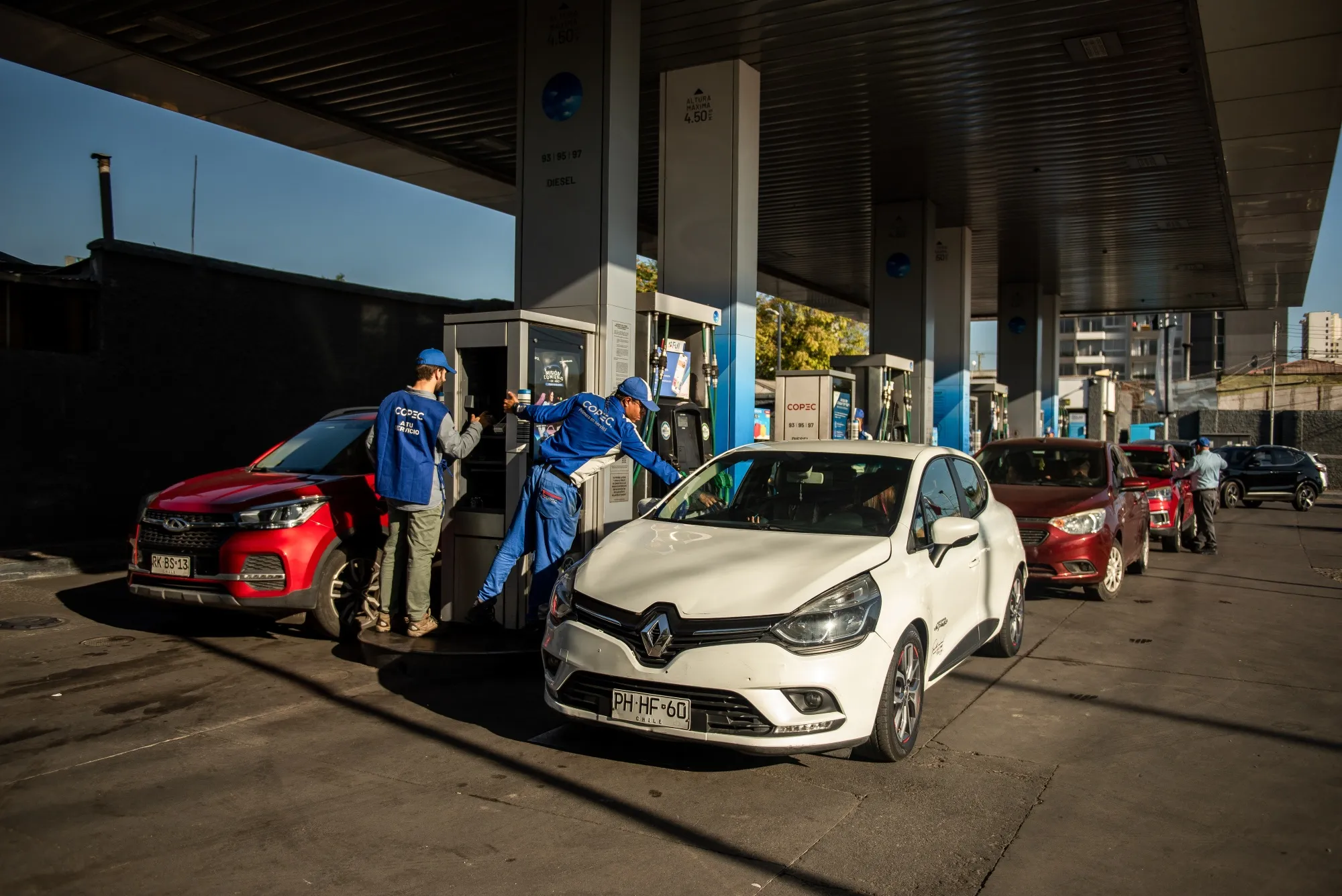 Customers wait in line to fuel up gas station in Santiago, Chile, on&nbsp;March 24.